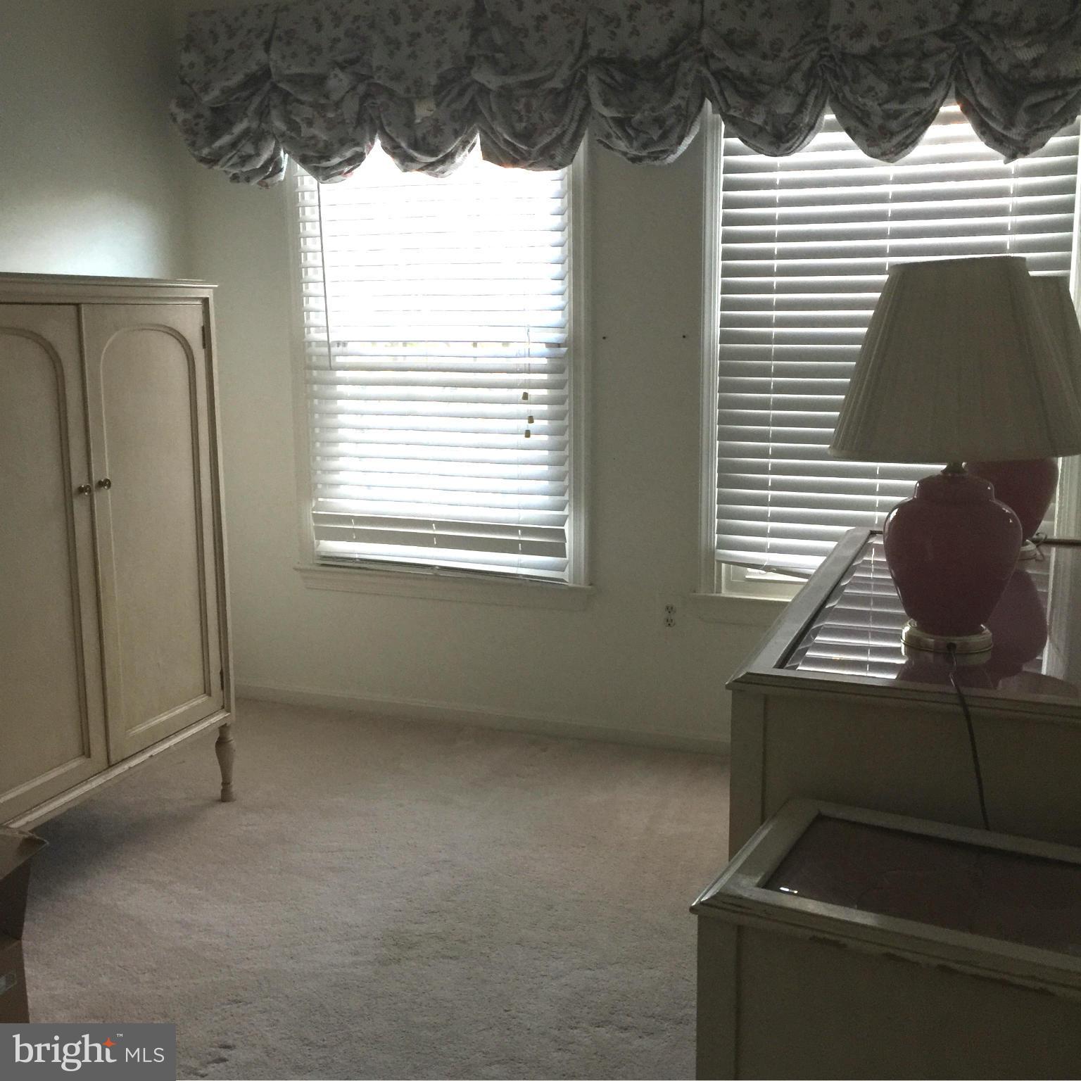 18801 Lindenhouse Road Gaithersburg, MD 20879 - Photo 13 of 22 a view of an empty room with a window