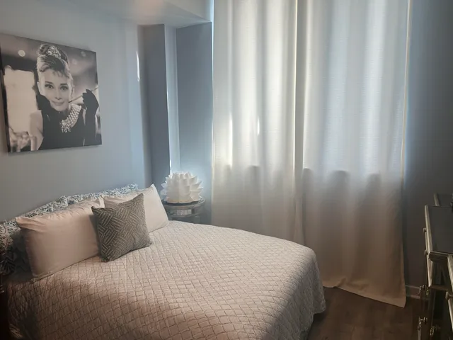 a living room with furniture window and wooden floor