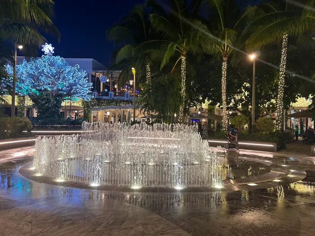 a childrens park with lots of swings and slides
