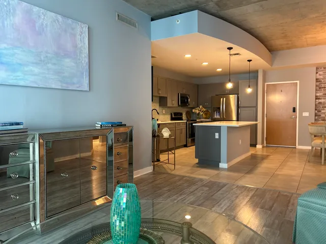 a kitchen with a sink a stove and cabinets