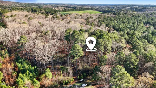a aerial view of a house with a yard