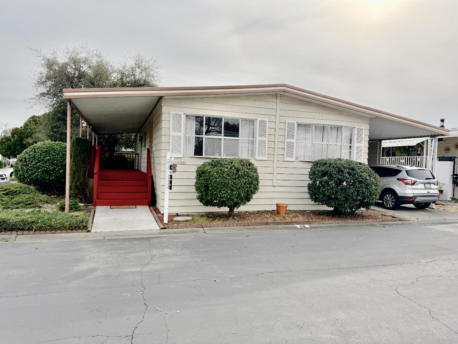a front view of a house with garden