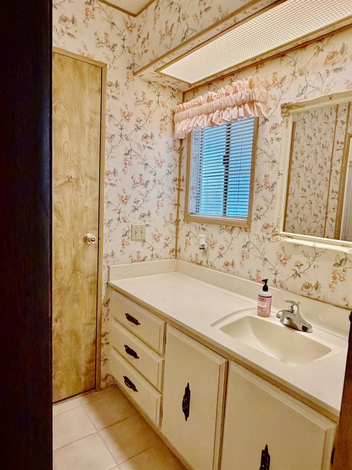 68 Yefim Roseville, CA 95661 - Photo 13 of 35 a bathroom with a sink and a mirror