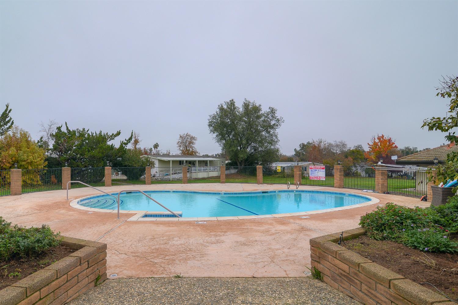 68 Yefim Roseville, CA 95661 - Photo 30 of 35 a view of a swimming pool with an outdoor seating
