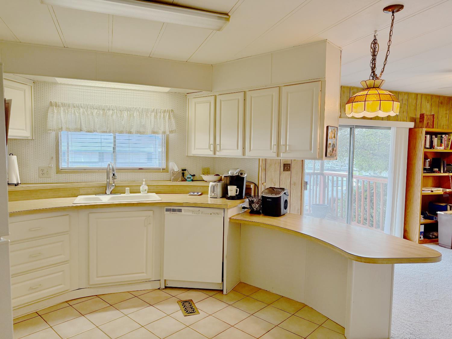 68 Yefim Roseville, CA 95661 - Photo 9 of 35 a kitchen with a sink cabinets and window