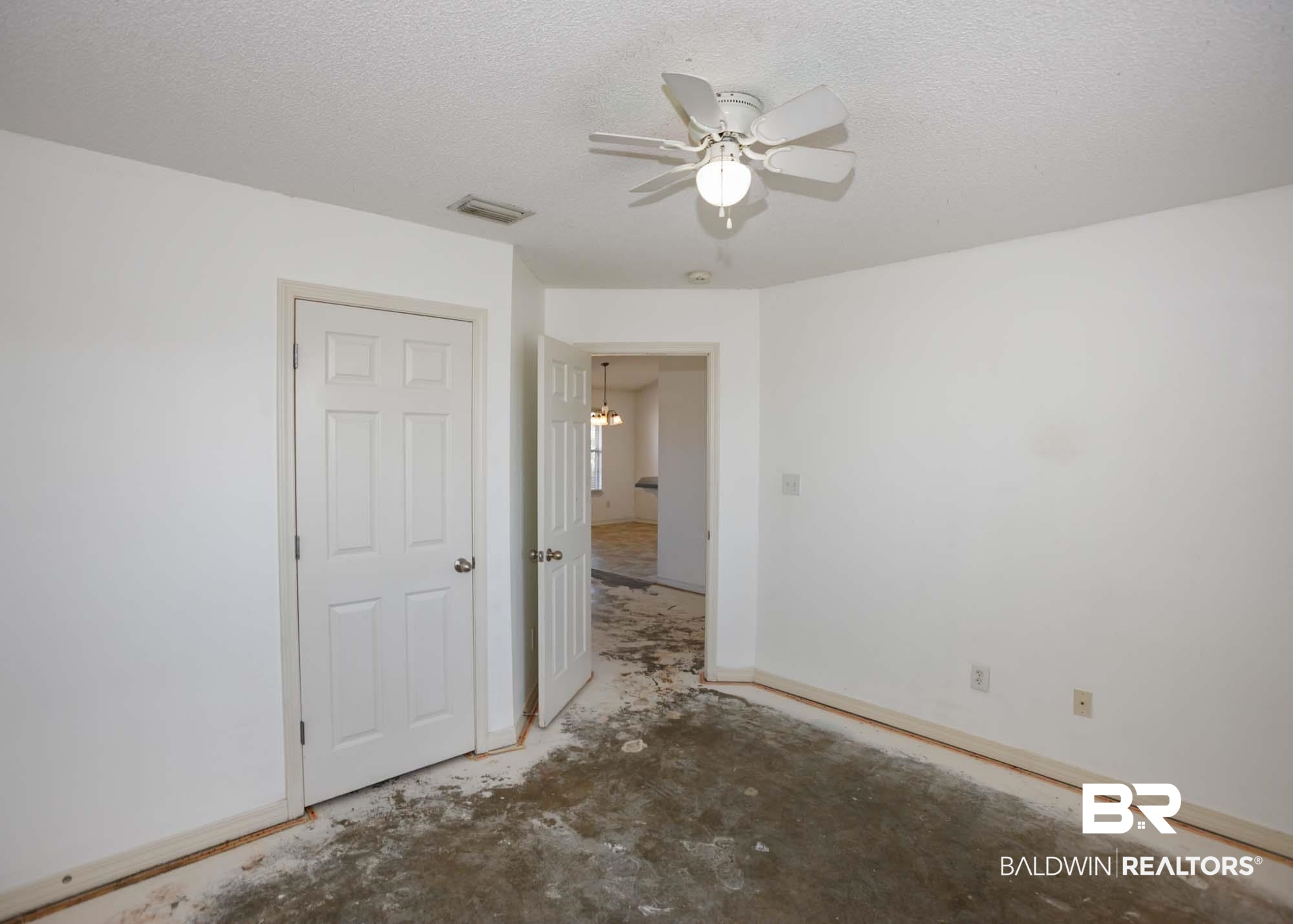 2530 Ashburn Lane Foley, AL 36535 - Photo 30 of 46 Unfurnished room with concrete flooring, a textured ceiling, and ceiling fan with notable chandelier
