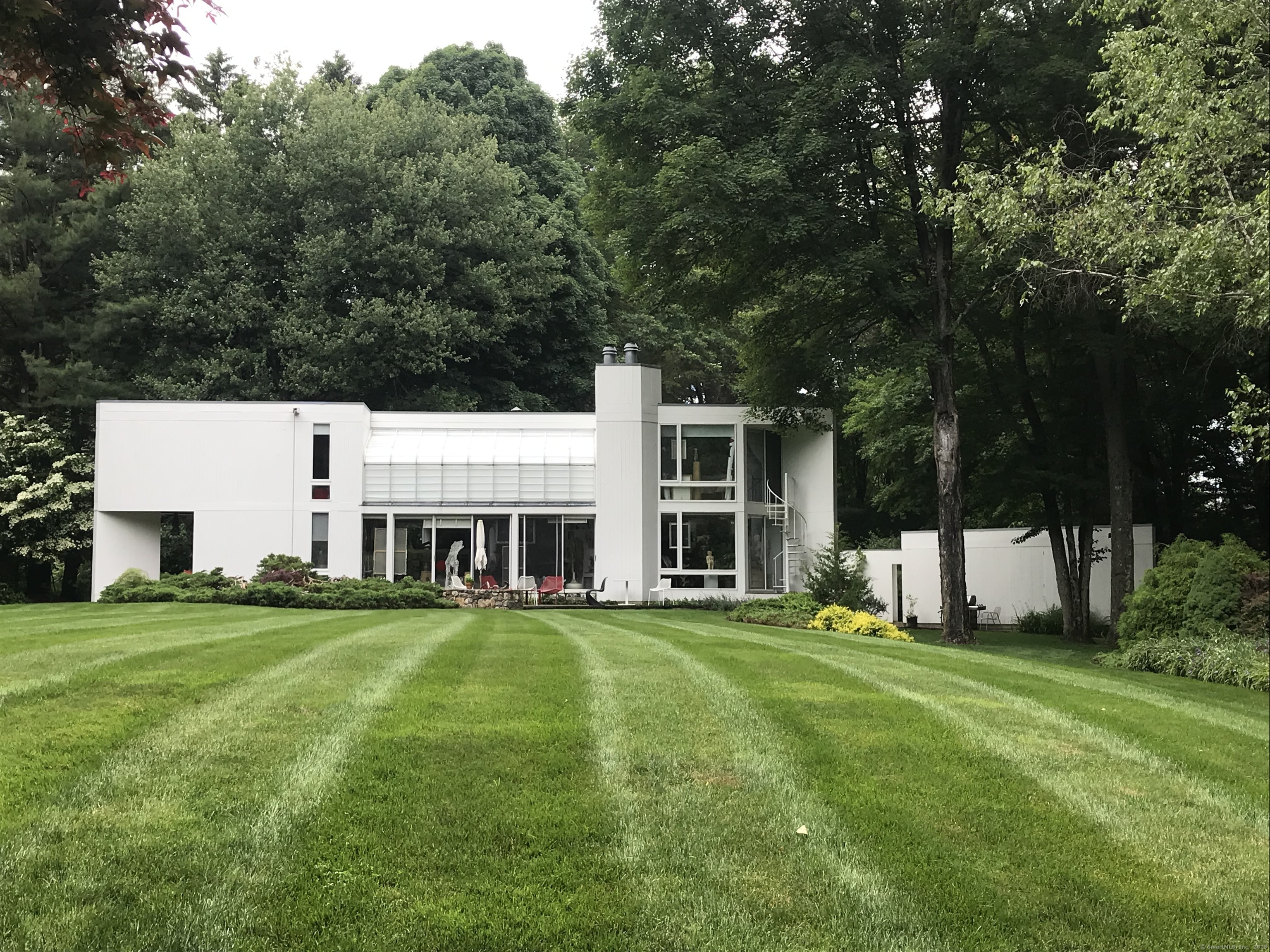 274 Nod Road Ridgefield, CT 06877 - Photo 2 of 2 a view of a house with a big yard and large trees
