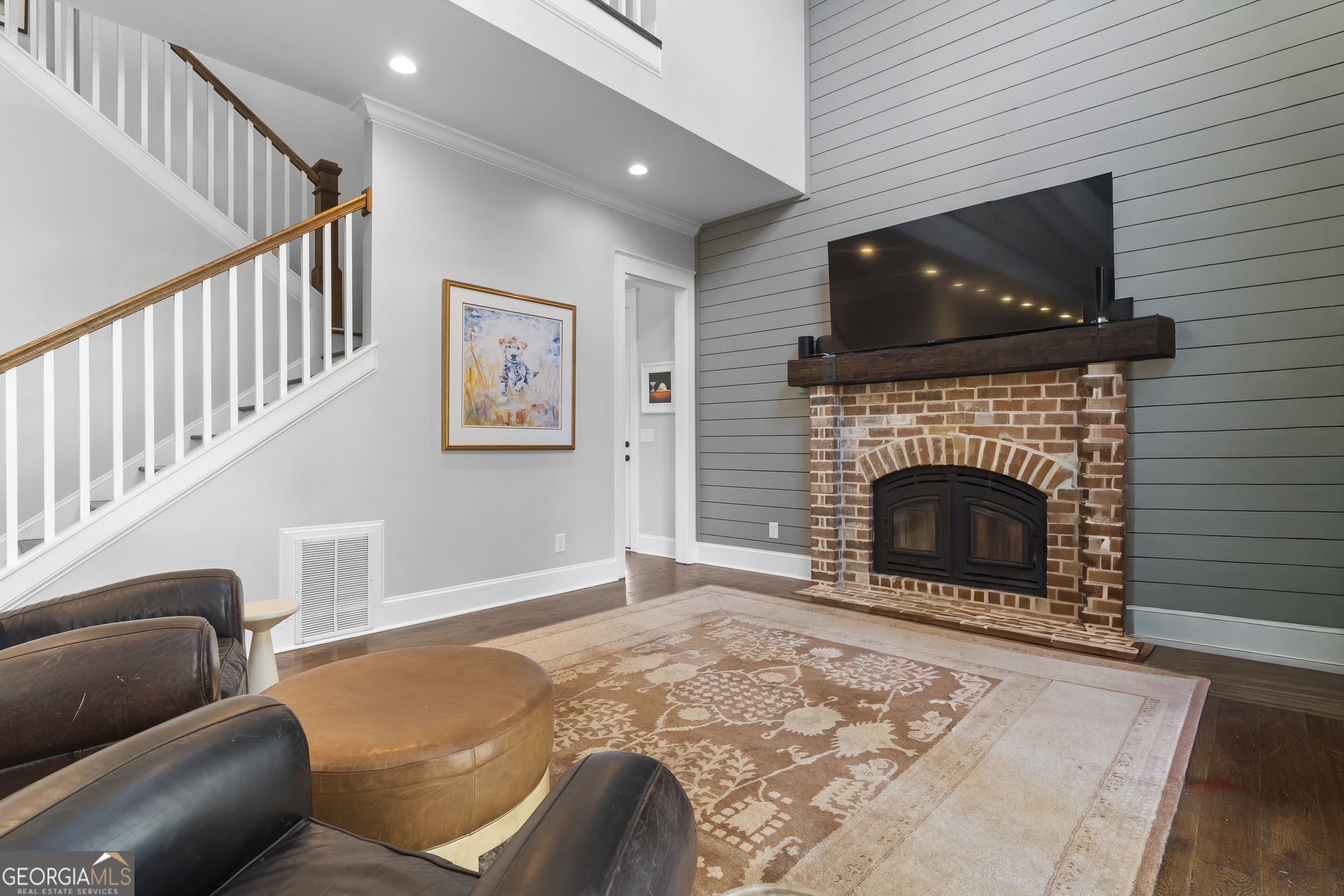 855 Jasper Street Madison, GA 30650 - Photo 17 of 46 a living room with furniture and a fireplace