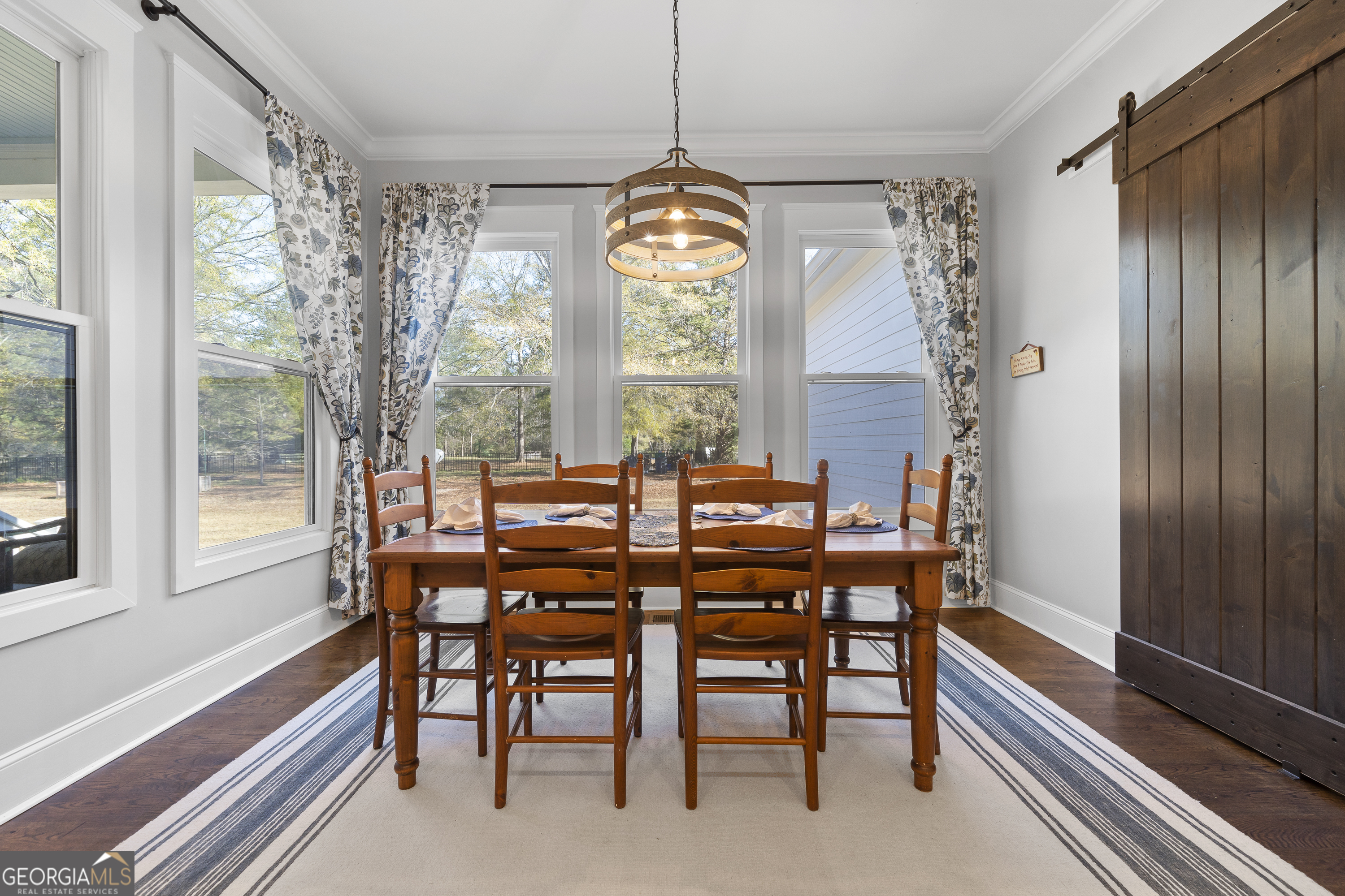 855 Jasper Street Madison, GA 30650 - Photo 19 of 46 a view of a dining room with furniture window and outside view