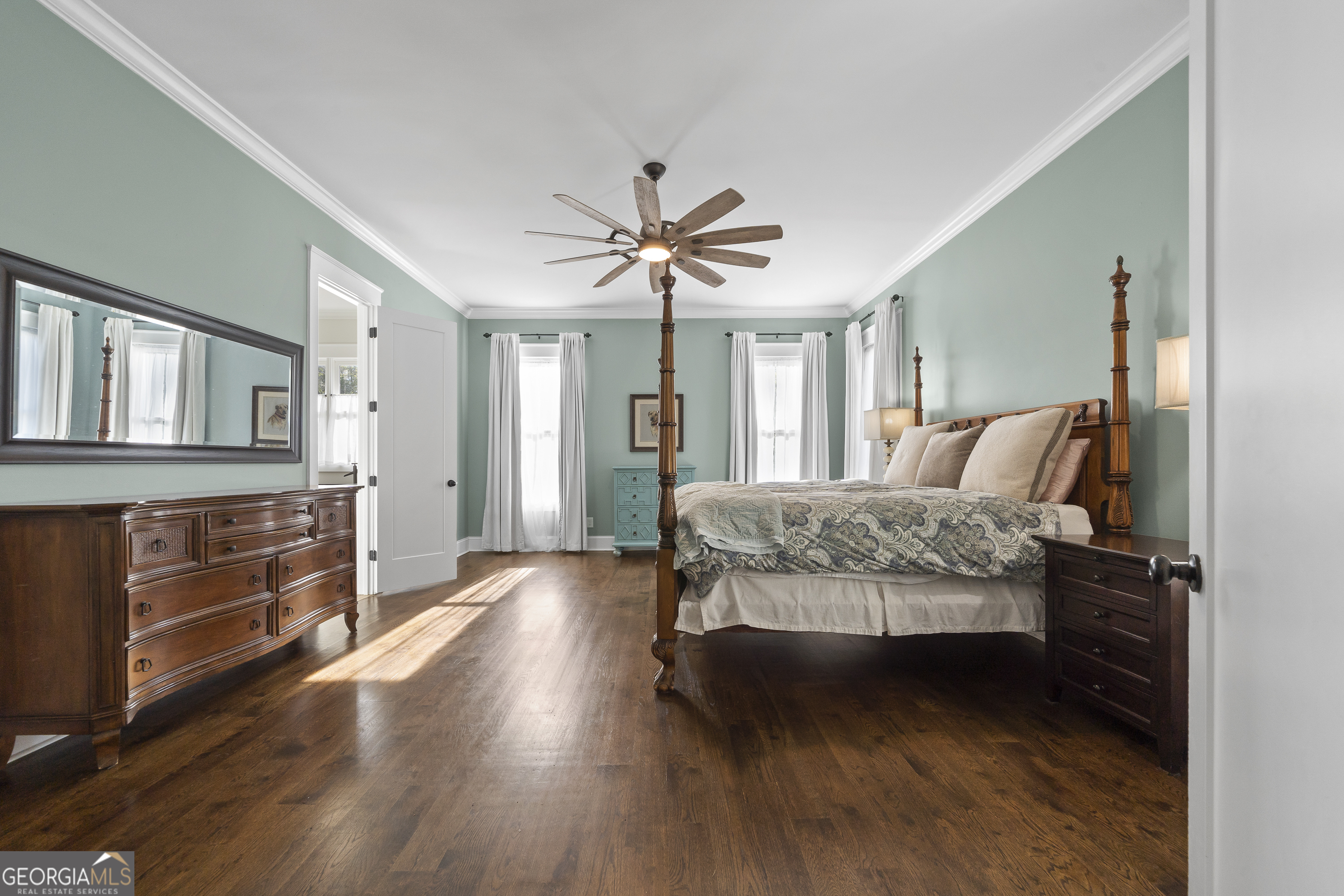 855 Jasper Street Madison, GA 30650 - Photo 21 of 46 a living room with furniture and a dresser with wooden floor