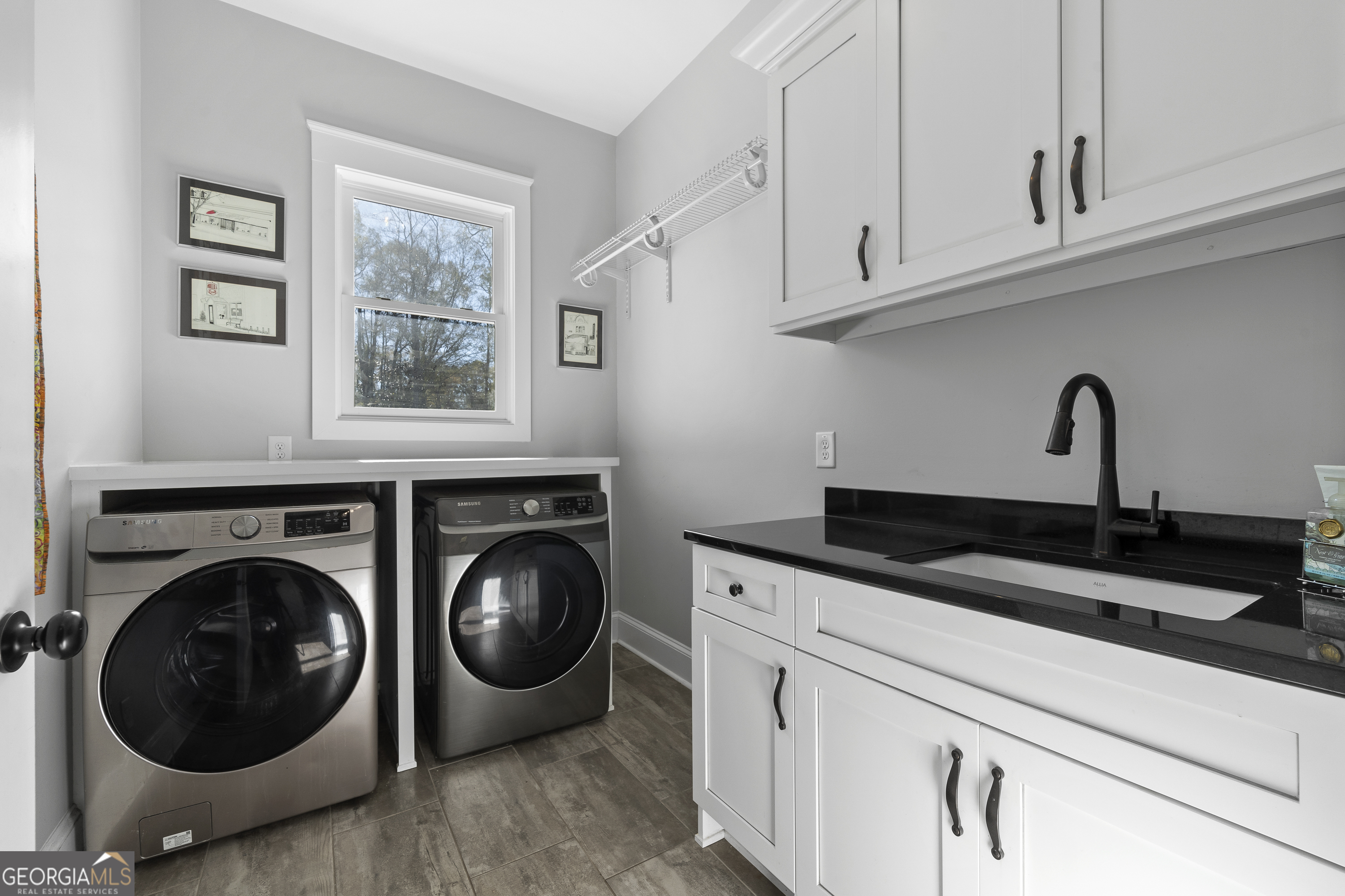 855 Jasper Street Madison, GA 30650 - Photo 26 of 46 a close view of a sink and washer and dryer