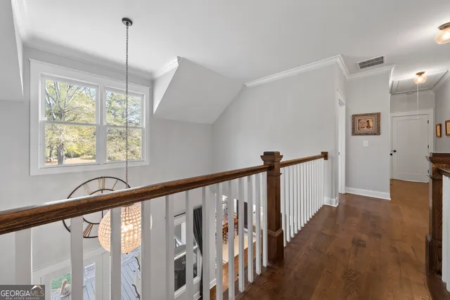 a view of an entryway with wooden floor