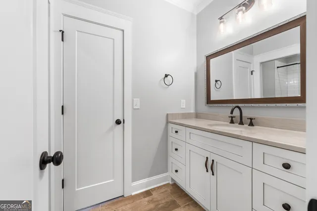 a bathroom with a double vanity sink and mirror