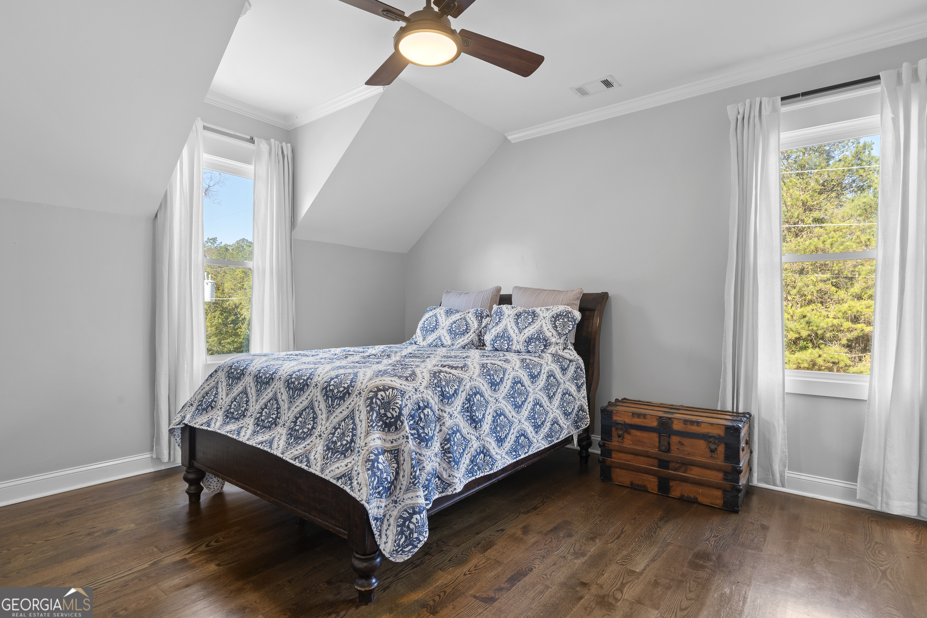 855 Jasper Street Madison, GA 30650 - Photo 34 of 46 a bedroom with a bed and a window