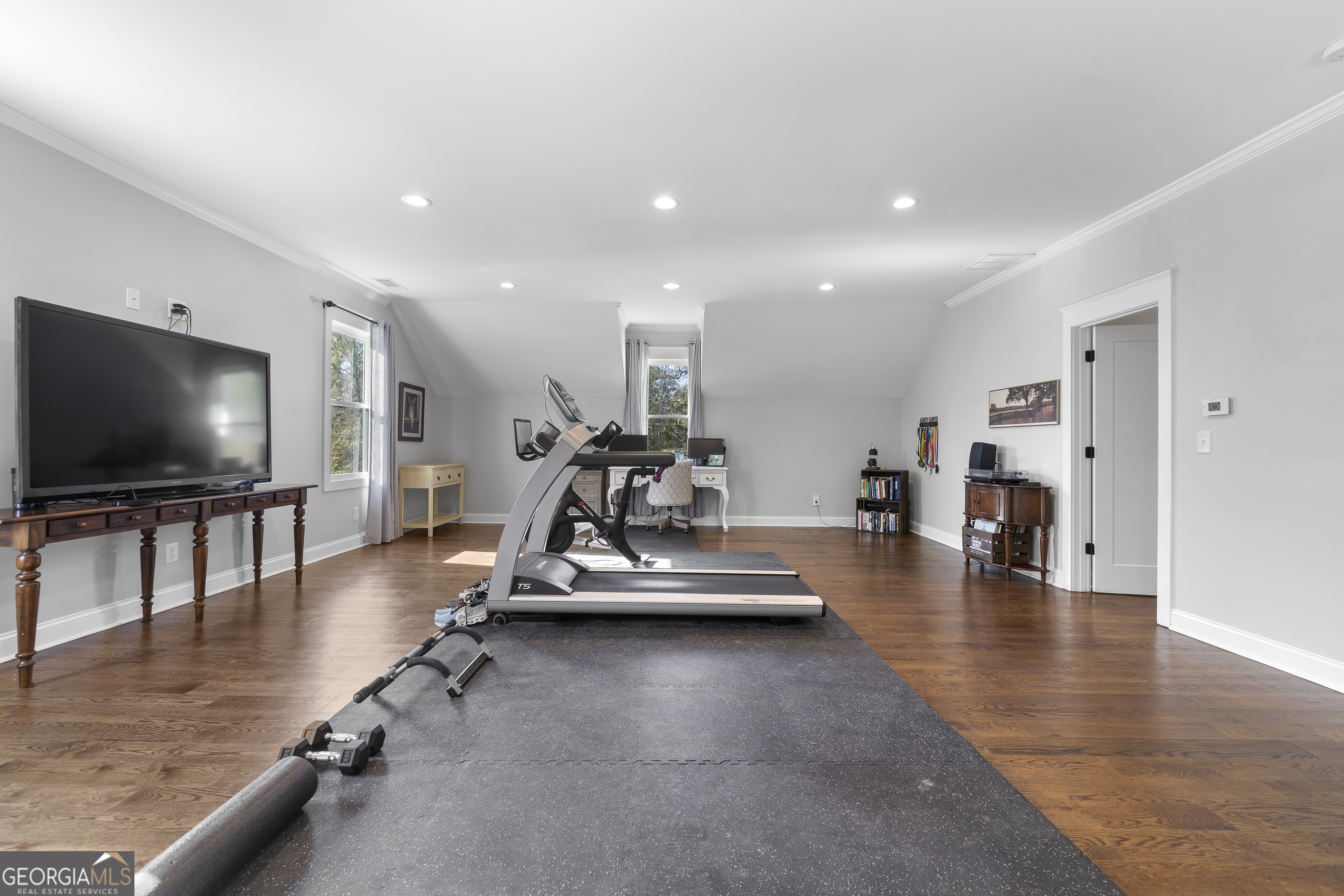 855 Jasper Street Madison, GA 30650 - Photo 39 of 46 a living room with furniture and a flat screen tv