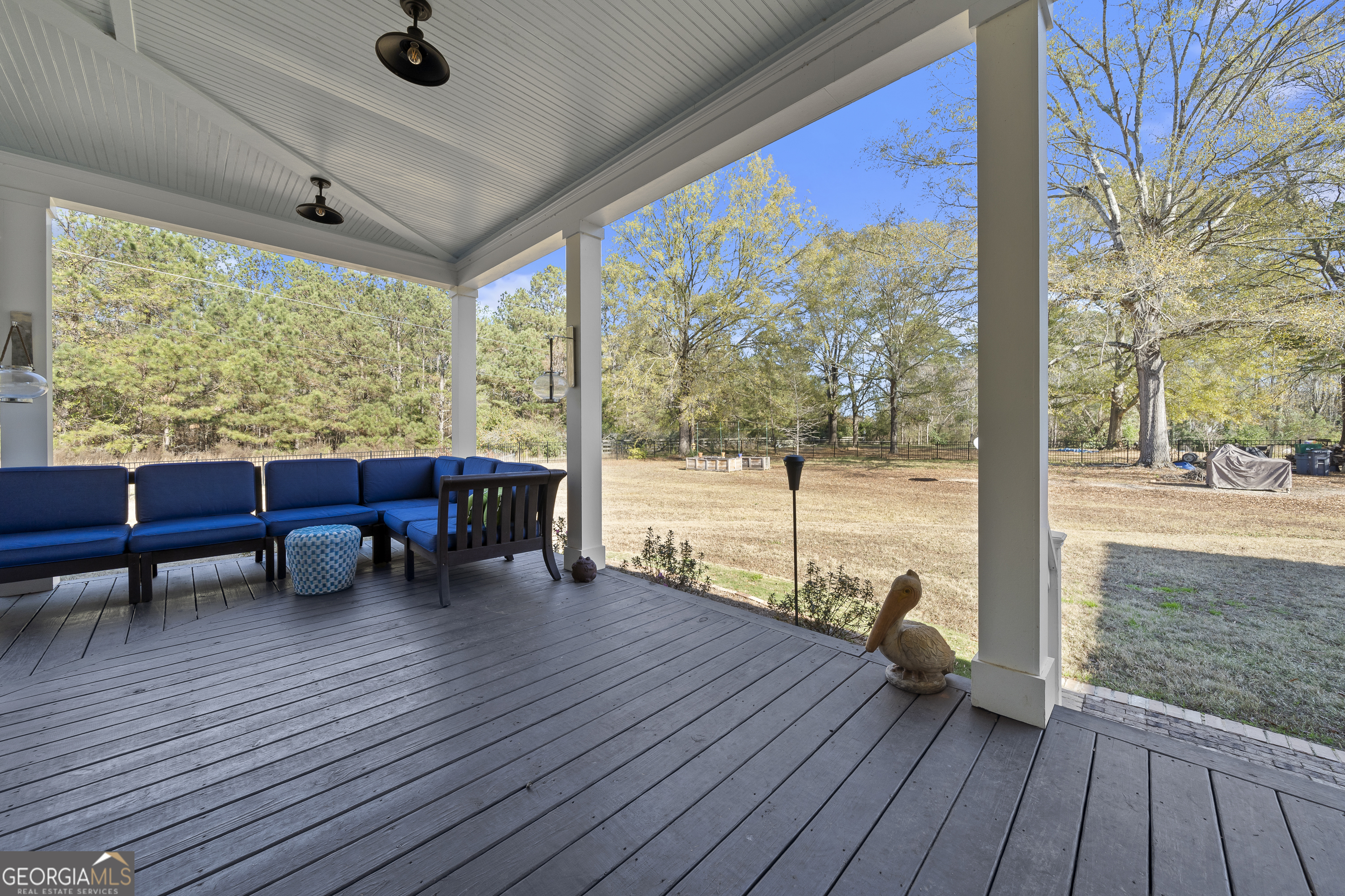 855 Jasper Street Madison, GA 30650 - Photo 40 of 46 a view of a porch with wooden floor and outdoor seating