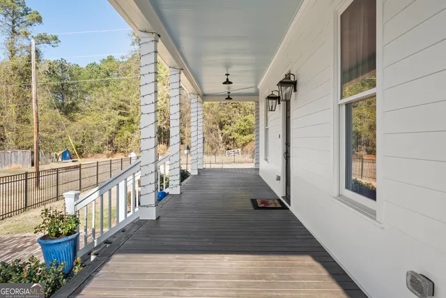 a view of a balcony with wooden floor