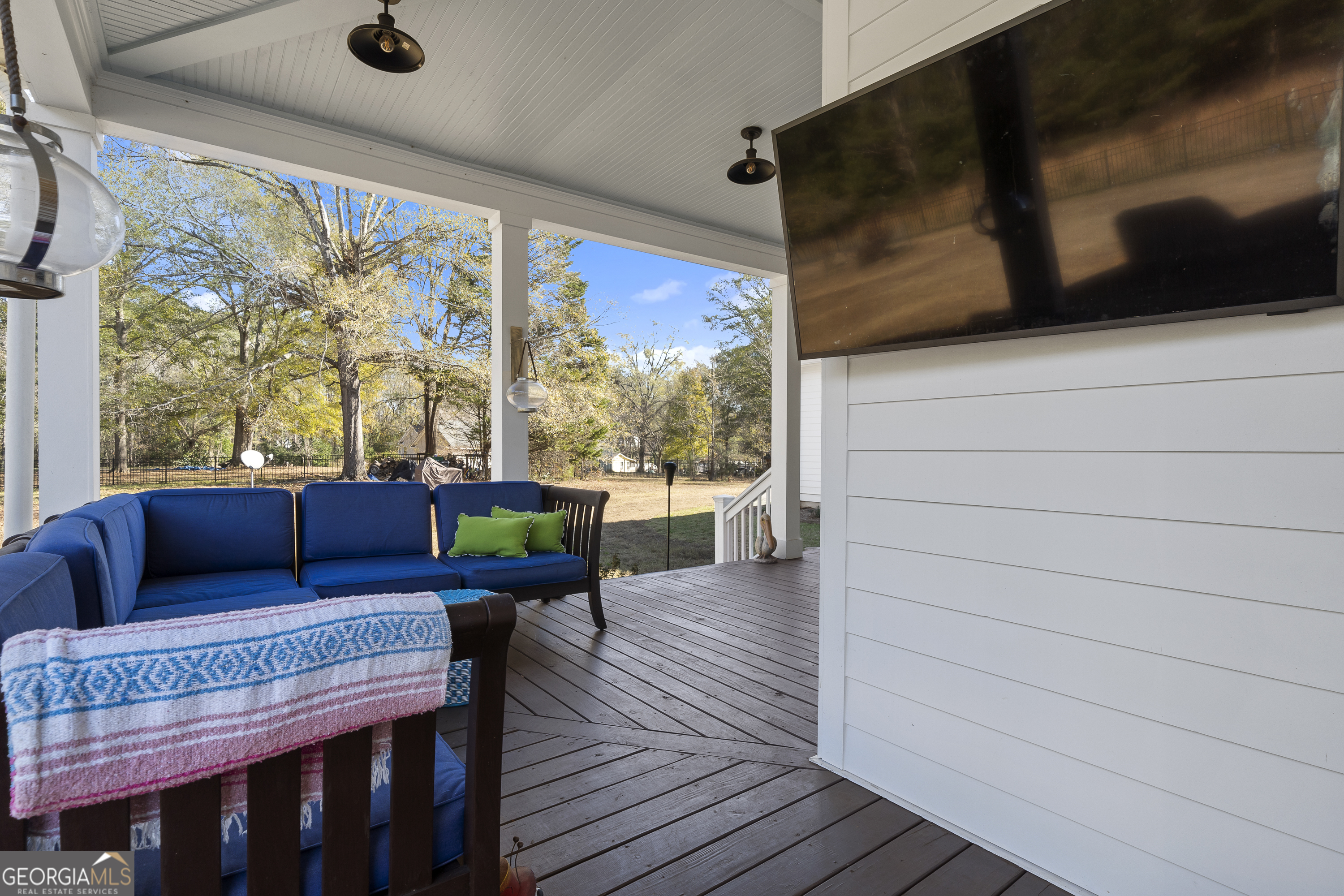 855 Jasper Street Madison, GA 30650 - Photo 41 of 46 a balcony with wooden floor and outdoor seating