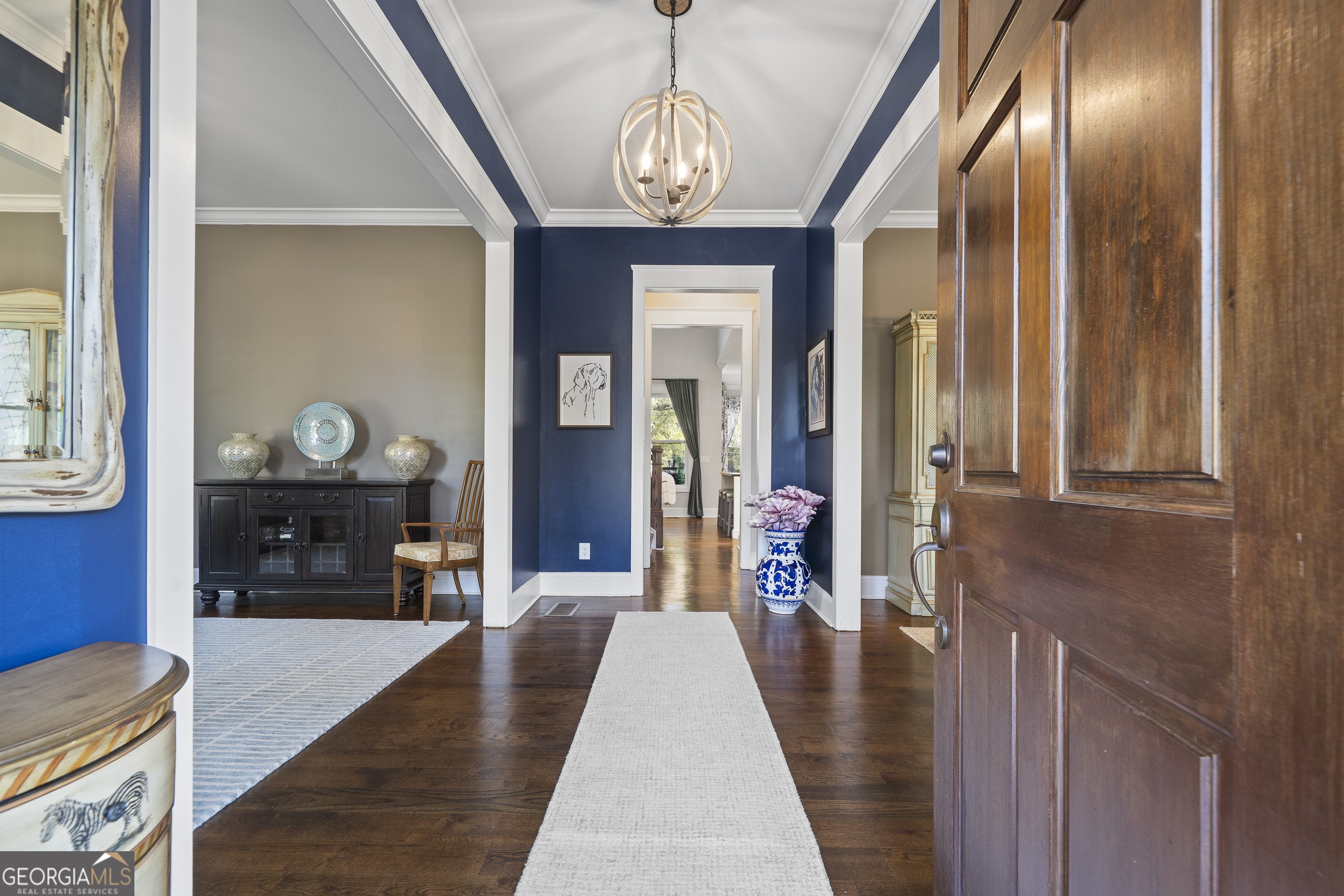 855 Jasper Street Madison, GA 30650 - Photo 5 of 46 a very nice looking dining room with a fireplace and chandelier