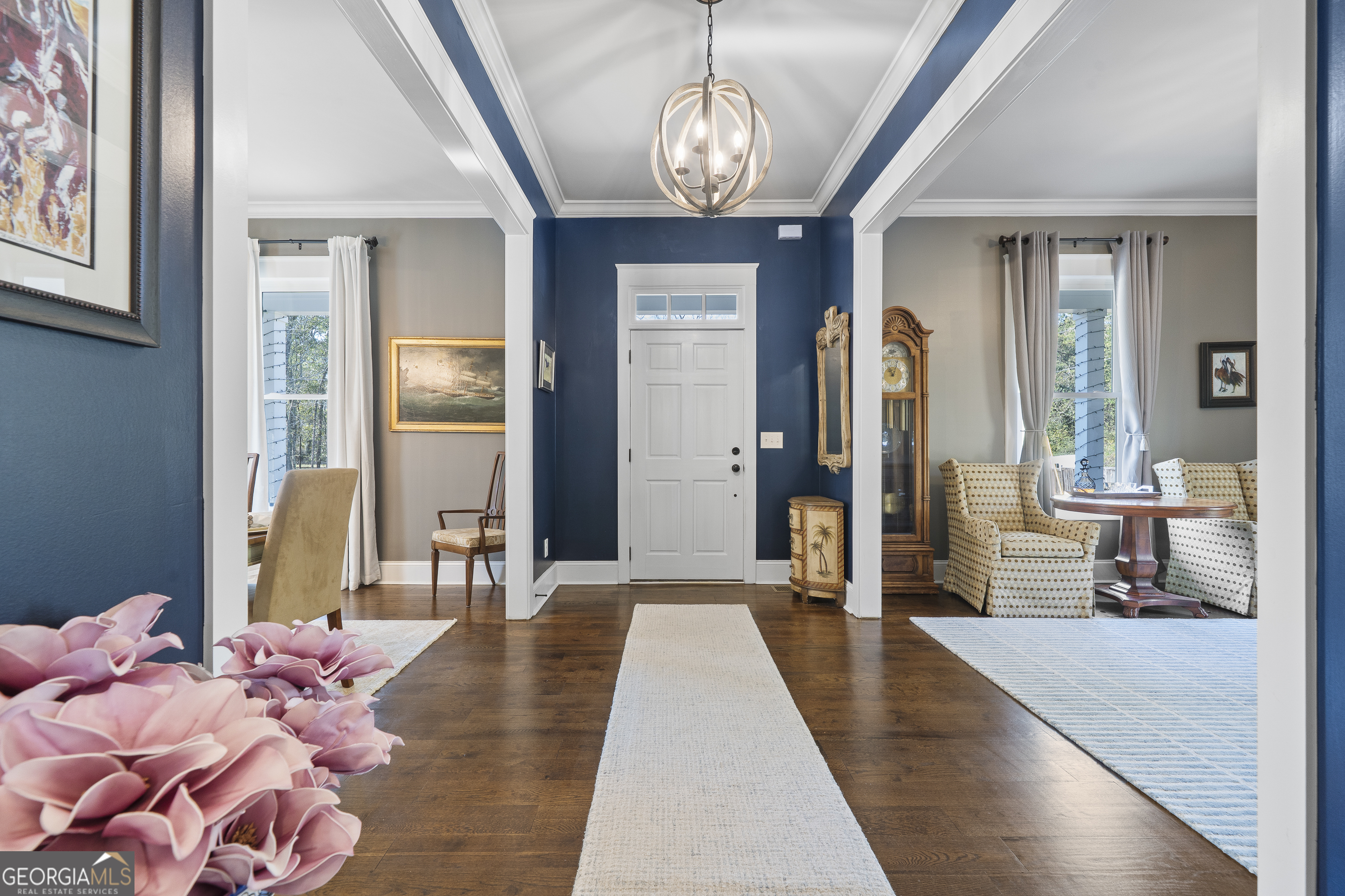 855 Jasper Street Madison, GA 30650 - Photo 6 of 46 a bedroom with chandelier and glass door