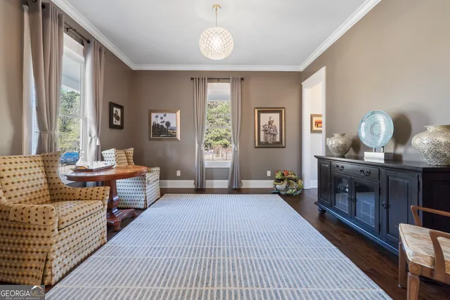 a bedroom with furniture and a window