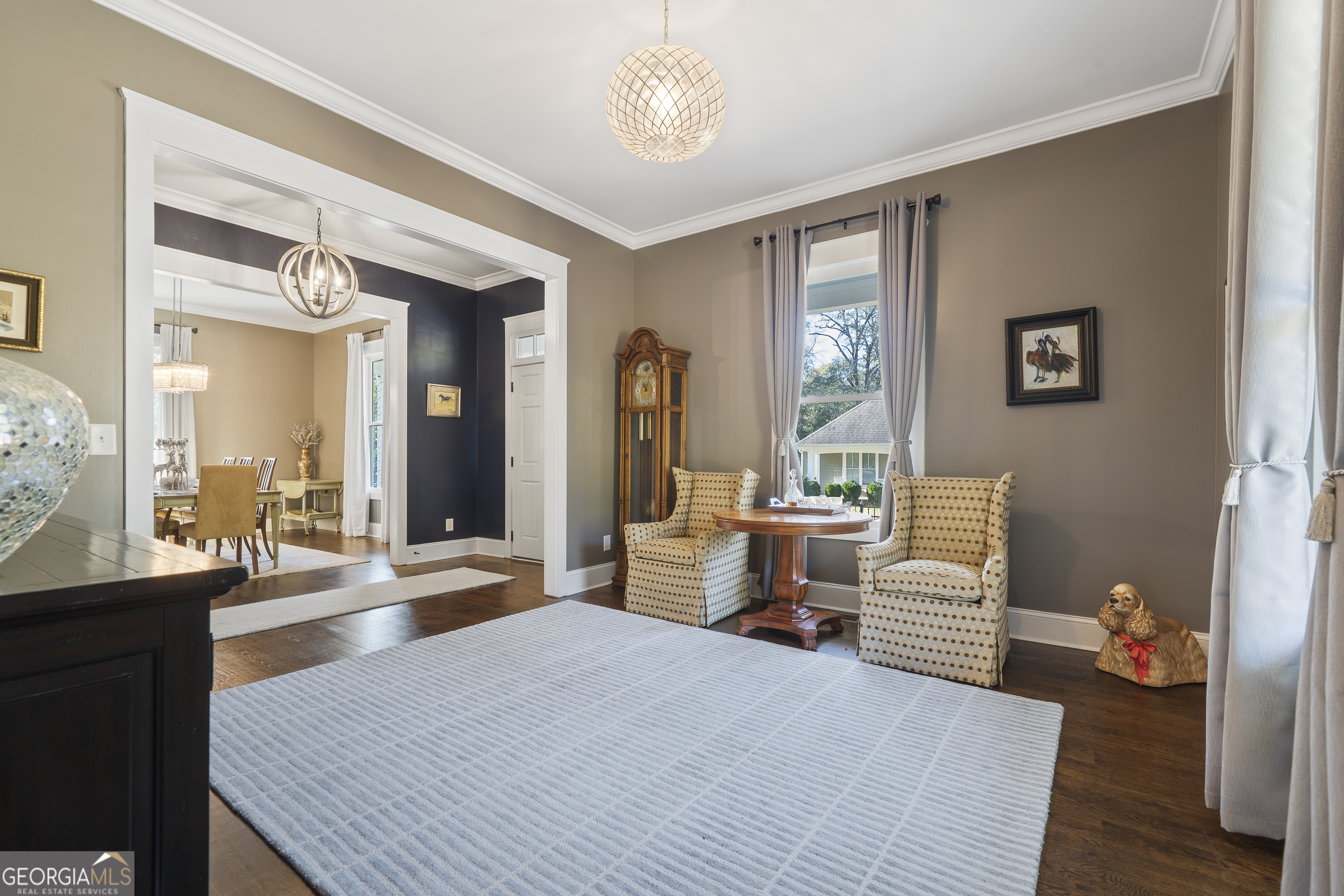 855 Jasper Street Madison, GA 30650 - Photo 8 of 46 a bedroom with a bed and wooden floor