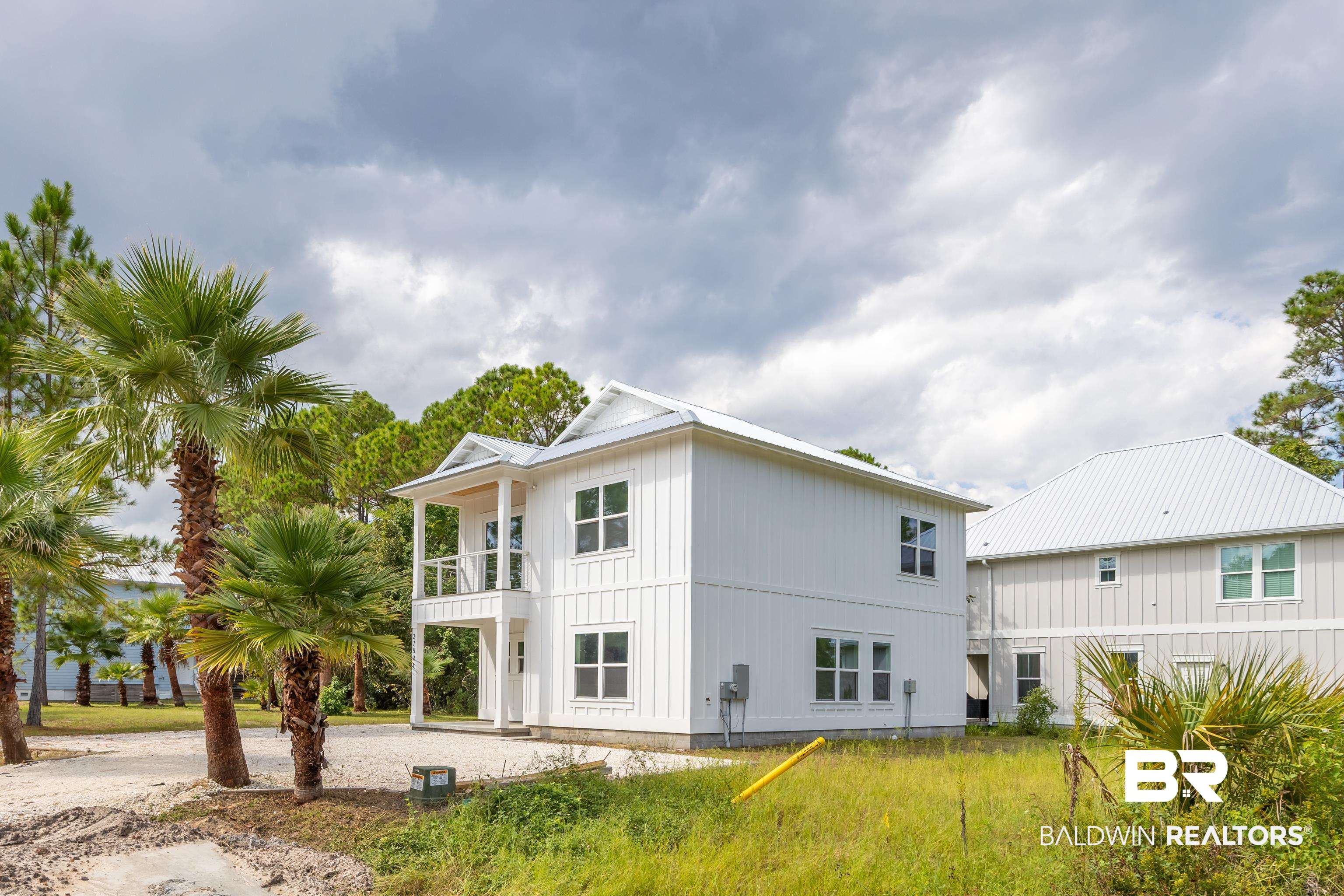 27591 Canal Road Orange Beach, AL 36561 - Photo 51 of 51 Back of property featuring driveway and a balcony