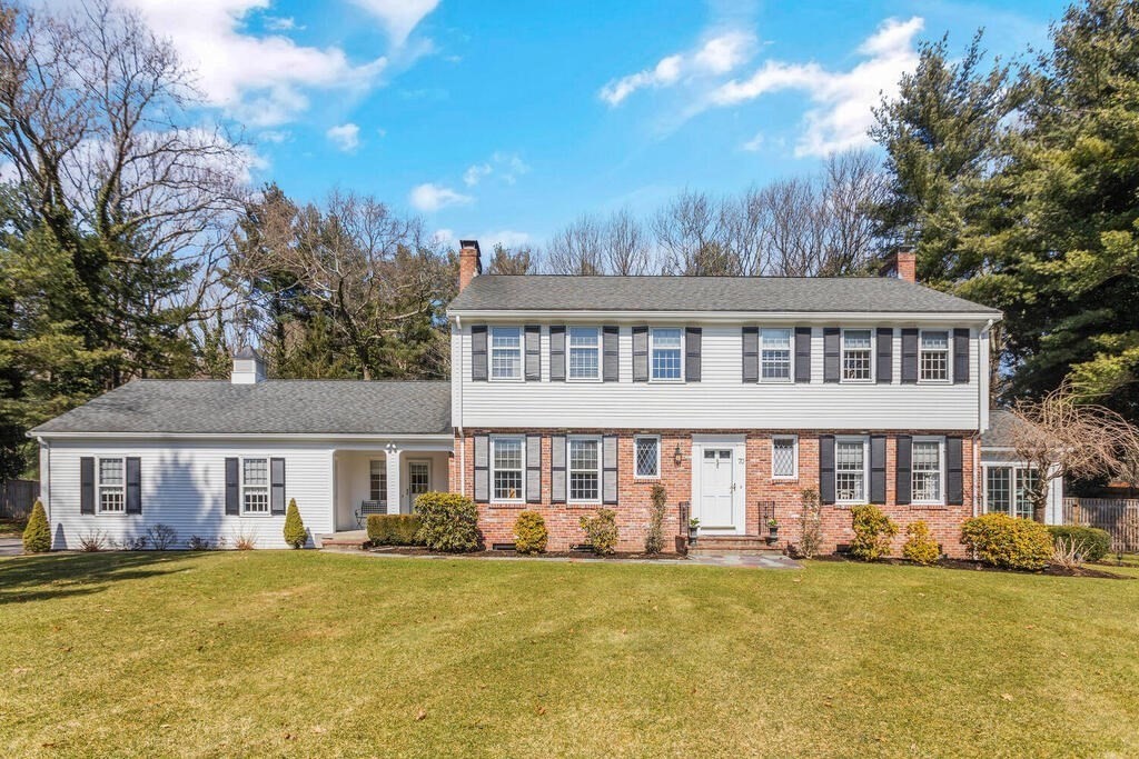 70 Windsor Road Needham, MA 02492 - Photo 1 of 35 a front view of a house with a yard