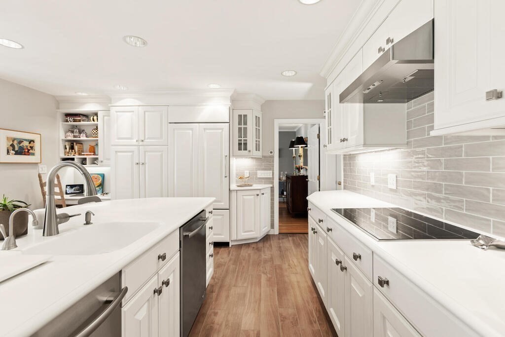 70 Windsor Road Needham, MA 02492 - Photo 11 of 35 a kitchen with granite countertop a sink stove and refrigerator