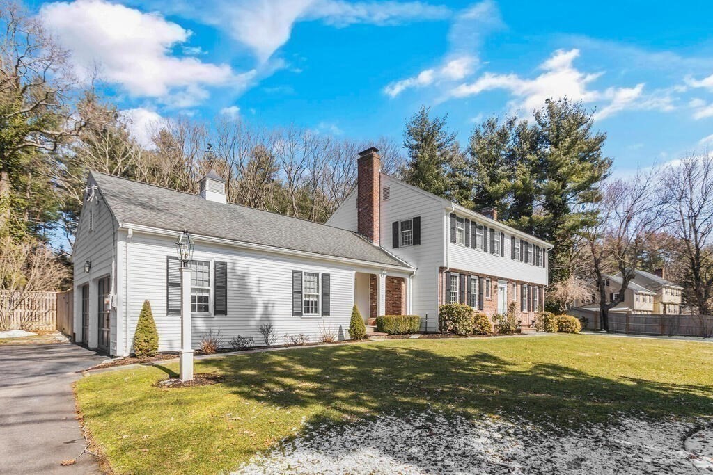 70 Windsor Road Needham, MA 02492 - Photo 4 of 35 a front view of a house with a yard
