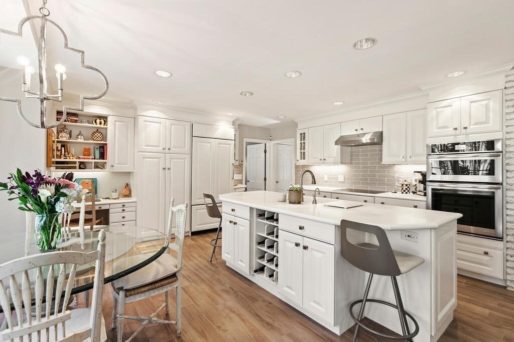70 Windsor Road Needham, MA 02492 - Photo 9 of 35 a kitchen that has a lot of cabinets in it and appliances