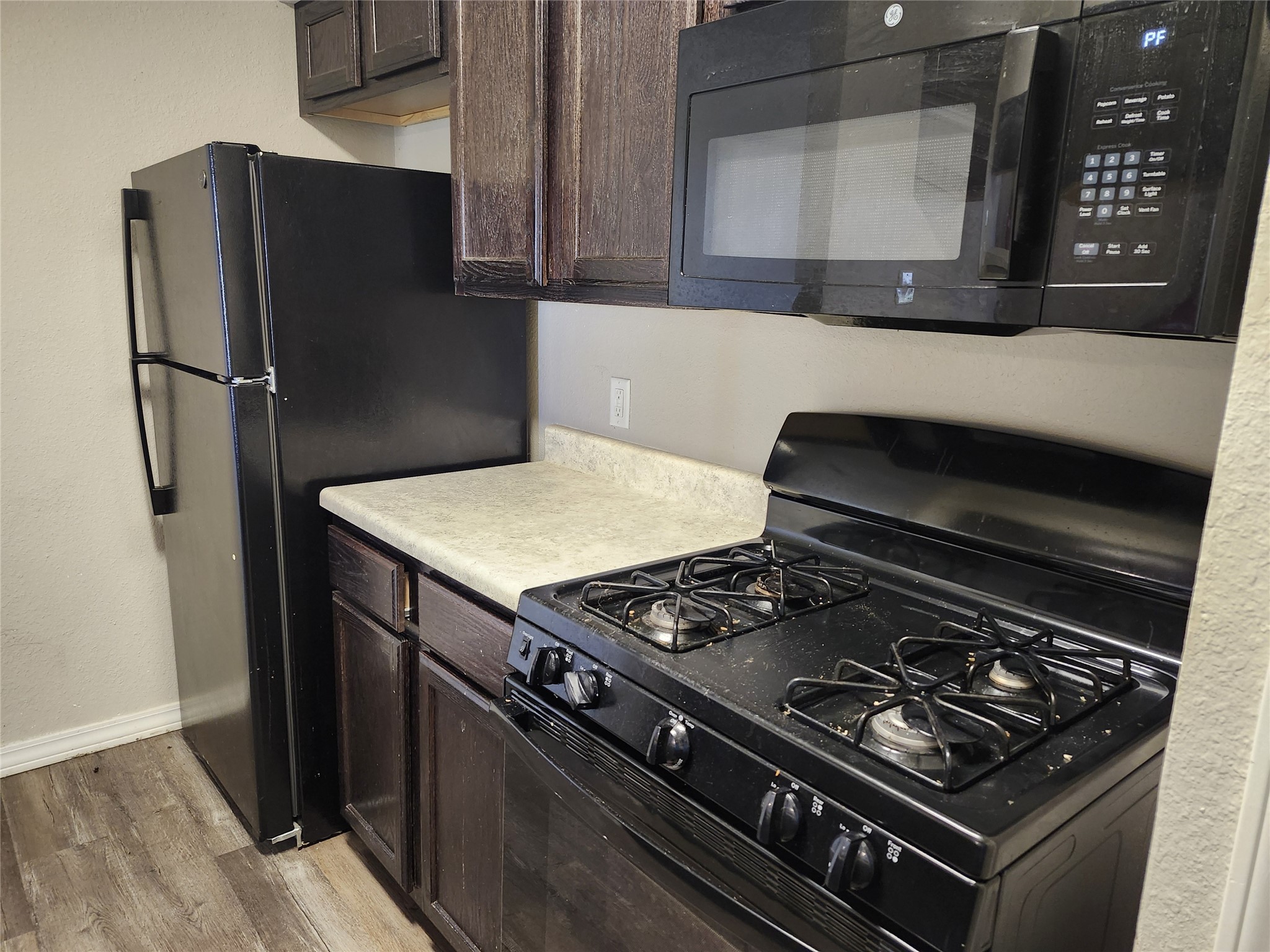 1000 South 8th Street Buckholts, TX 76518 - Photo 11 of 13 a stove top oven sitting inside of a kitchen