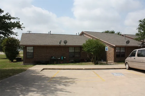 a view of house with yard and entertaining space