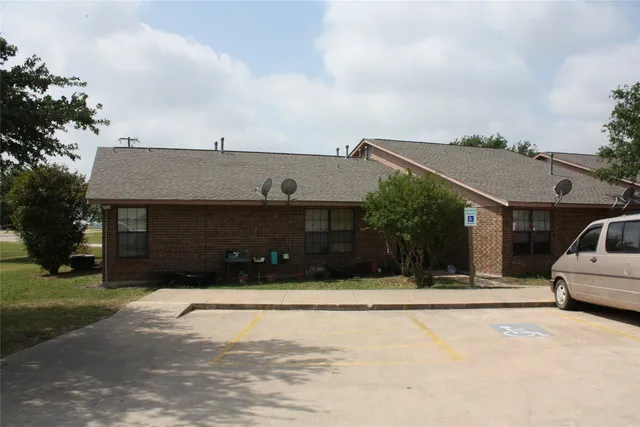 a view of house with yard and entertaining space