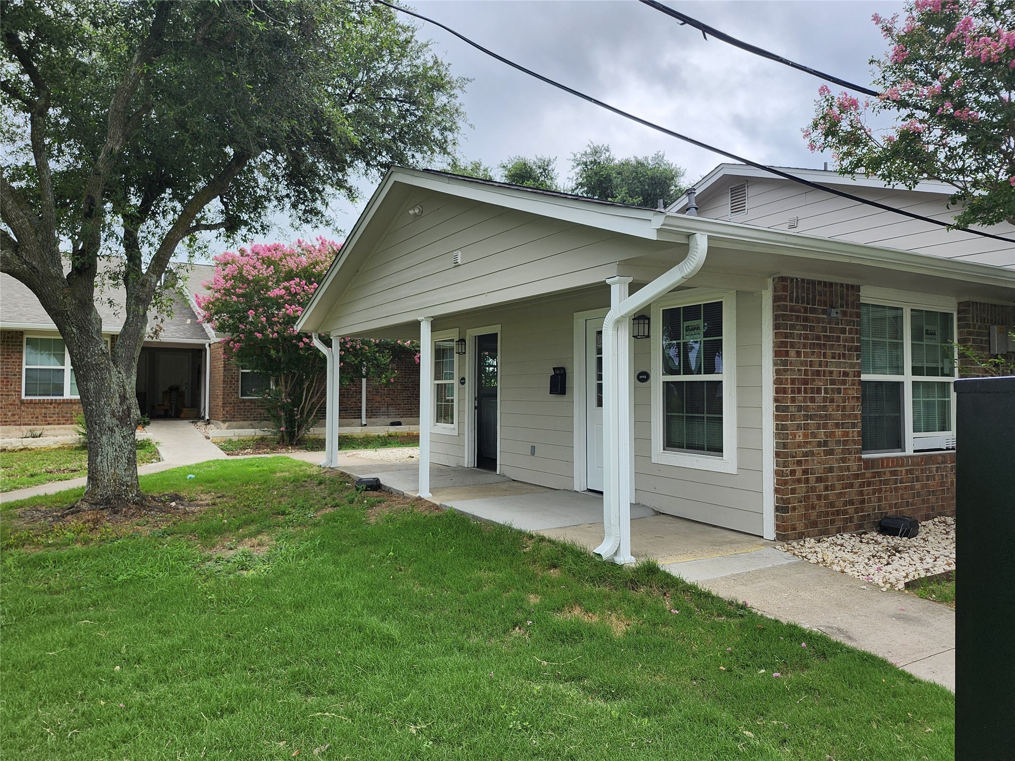 1000 South 8th Street Buckholts, TX 76518 - Photo 3 of 13 a front view of a house with a garden