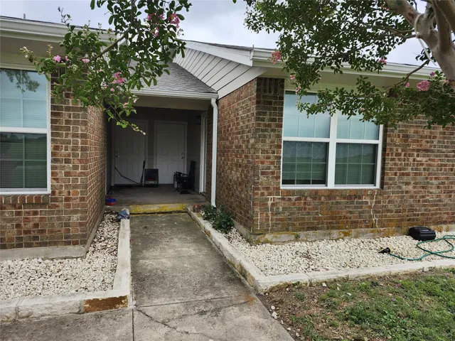 a view of entrance gate of a house