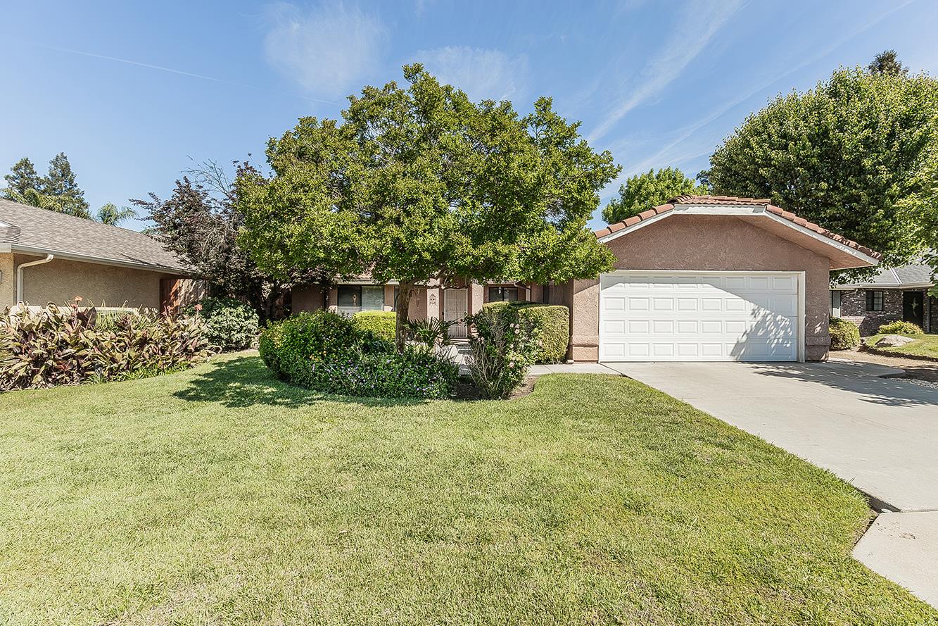1908 East Niles Avenue Fresno, CA 93720 - Photo 30 of 30 a front view of a house with a yard and garage