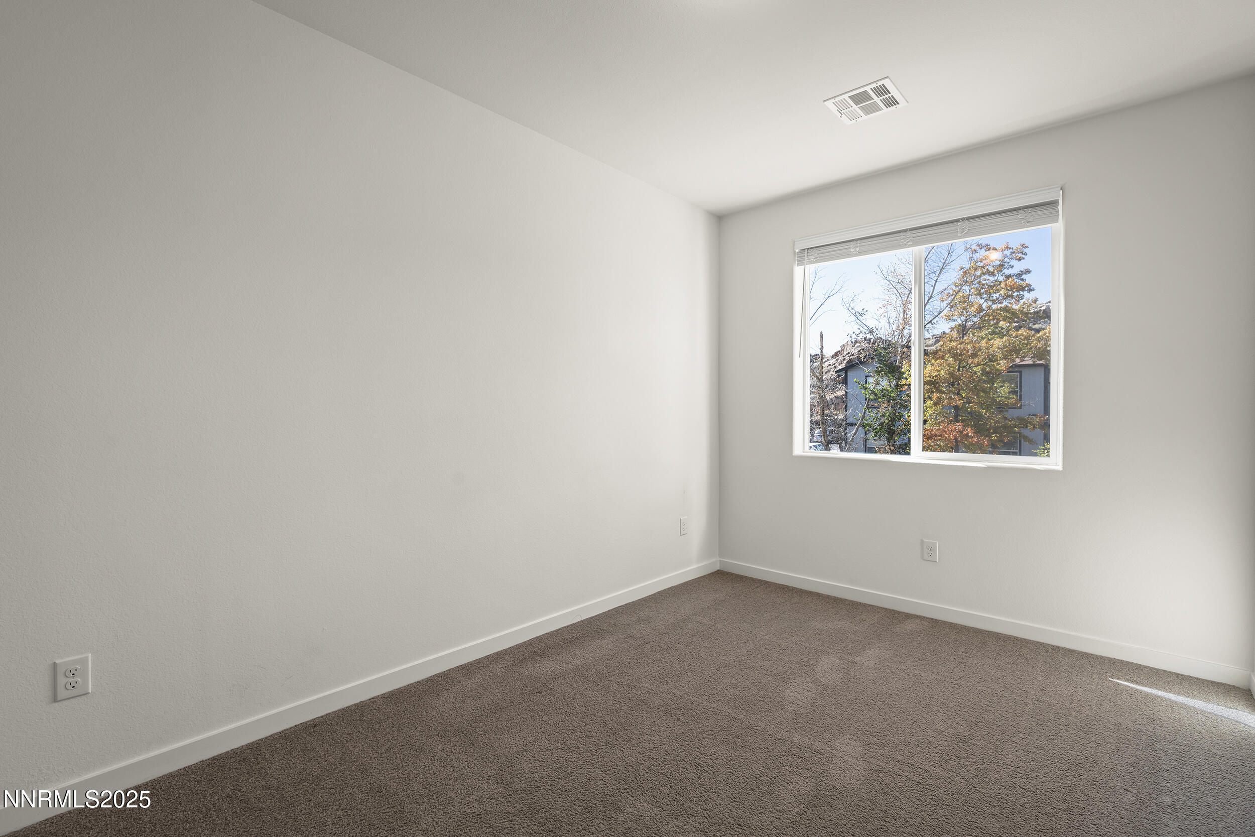 5013 Cavestone Road Sun Valley, NV 89433 - Photo 19 of 21 an empty room with a window