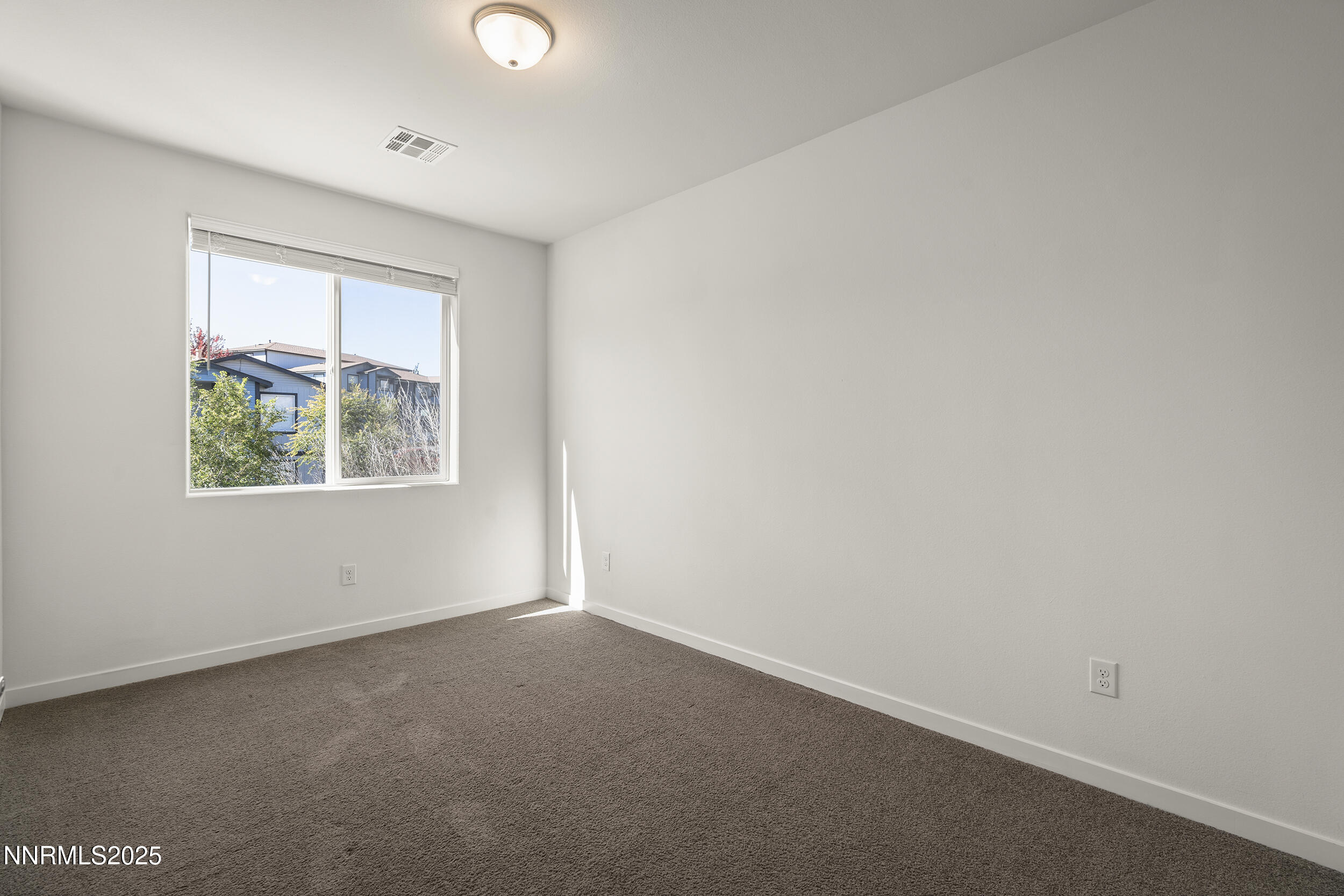 5013 Cavestone Road Sun Valley, NV 89433 - Photo 20 of 21 an empty room with a window