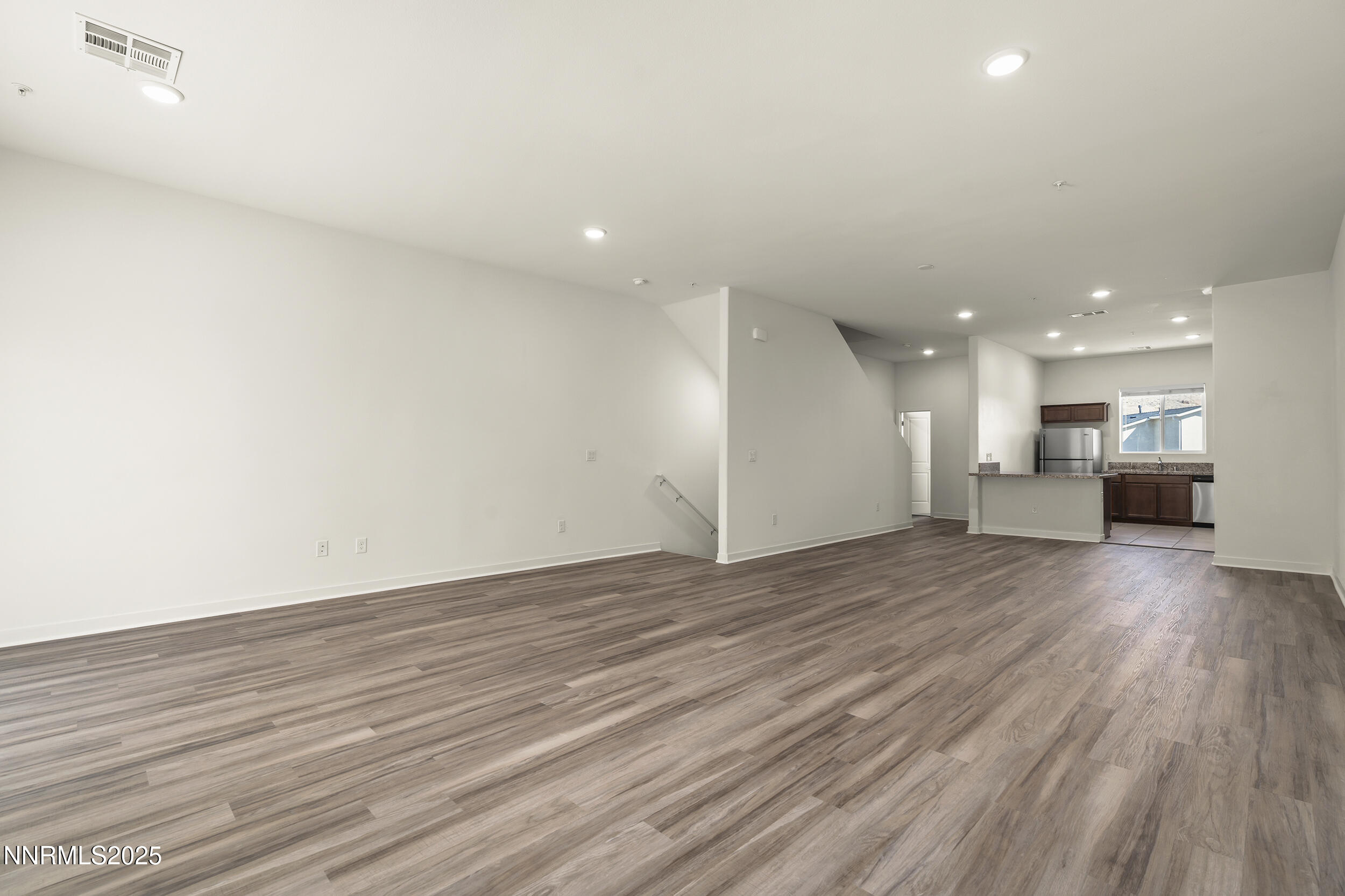 5013 Cavestone Road Sun Valley, NV 89433 - Photo 5 of 21 a view of kitchen and hall with wooden floor