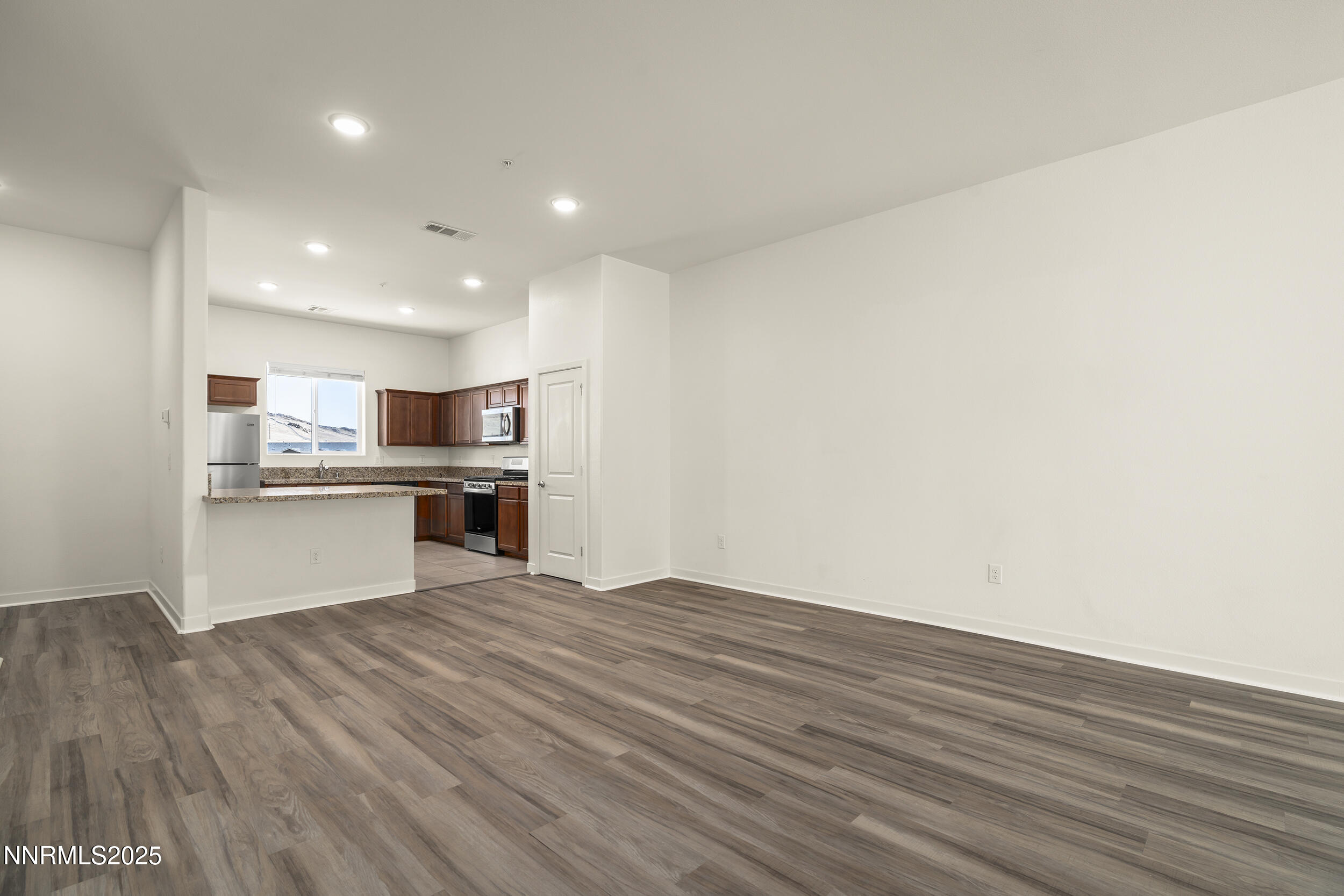 5013 Cavestone Road Sun Valley, NV 89433 - Photo 9 of 21 a view of kitchen with wooden floor
