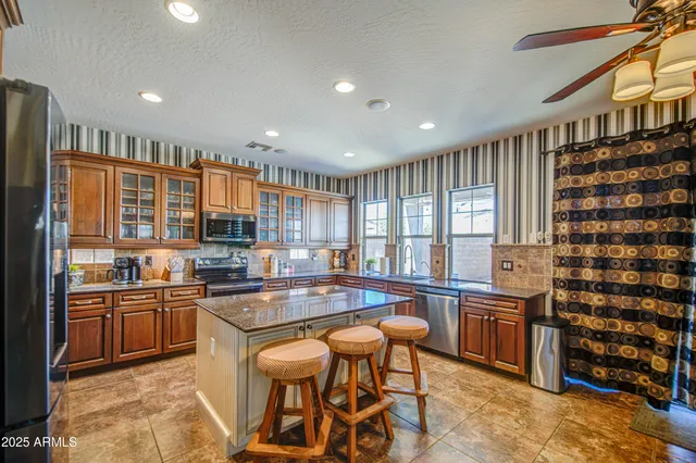 a spacious bathroom with a sink a vanity and a mirror