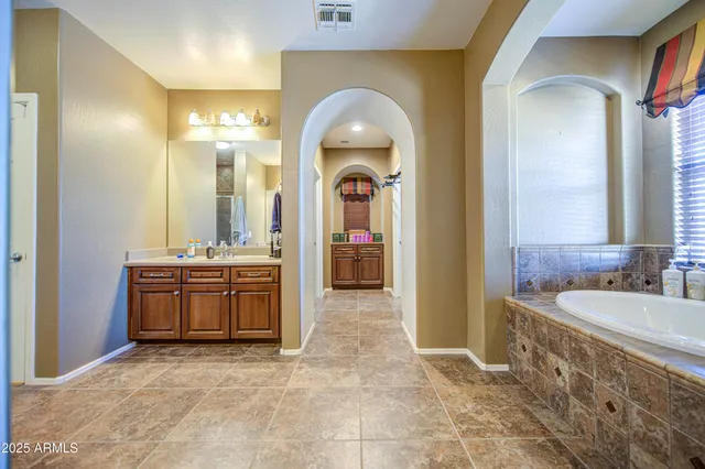 a white toilet sitting next to a small bathroom