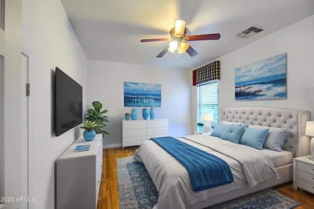 a roof deck with table and chairs