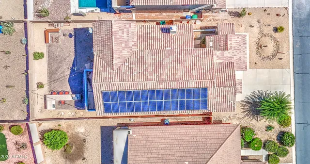 a view of a room with chairs and wooden floor