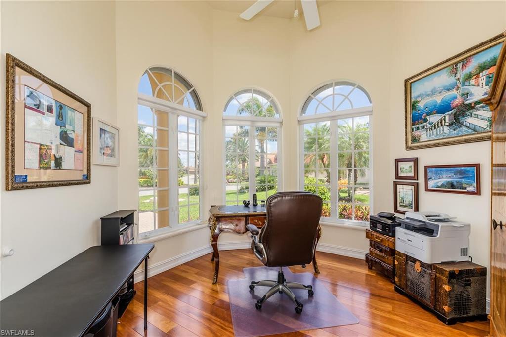 7025 Kiwi Place Naples, FL 34113 - Photo 16 of 28 a view of a livingroom with workspace and a window