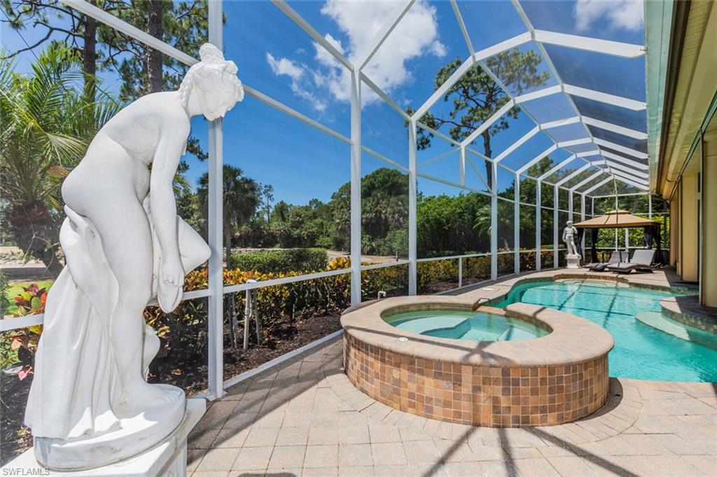 7025 Kiwi Place Naples, FL 34113 - Photo 22 of 28 a view of a chairs and table in the patio