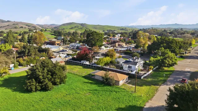 a view of a city with mountains in the background