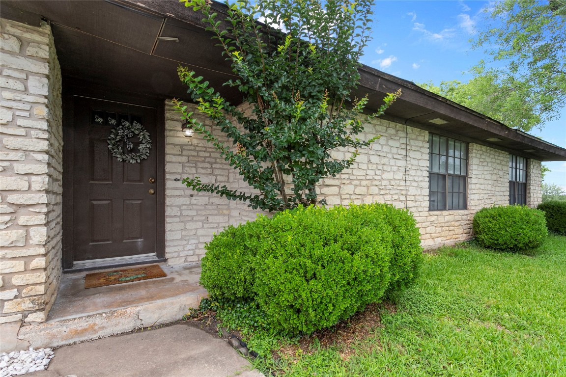 a view of a house with a small yard