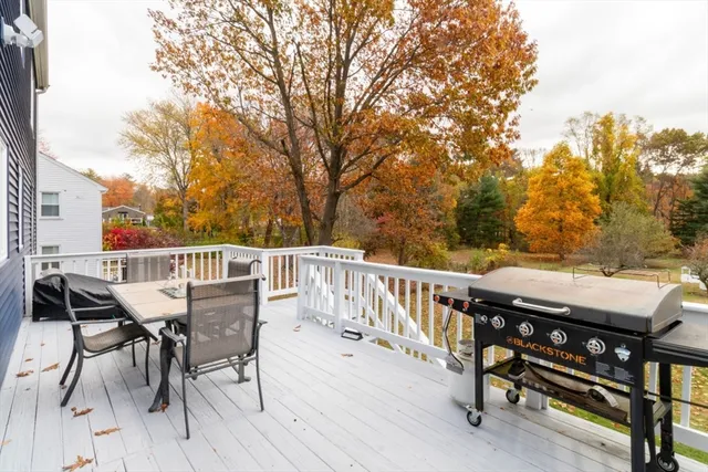 a view of a deck with two chairs and a table